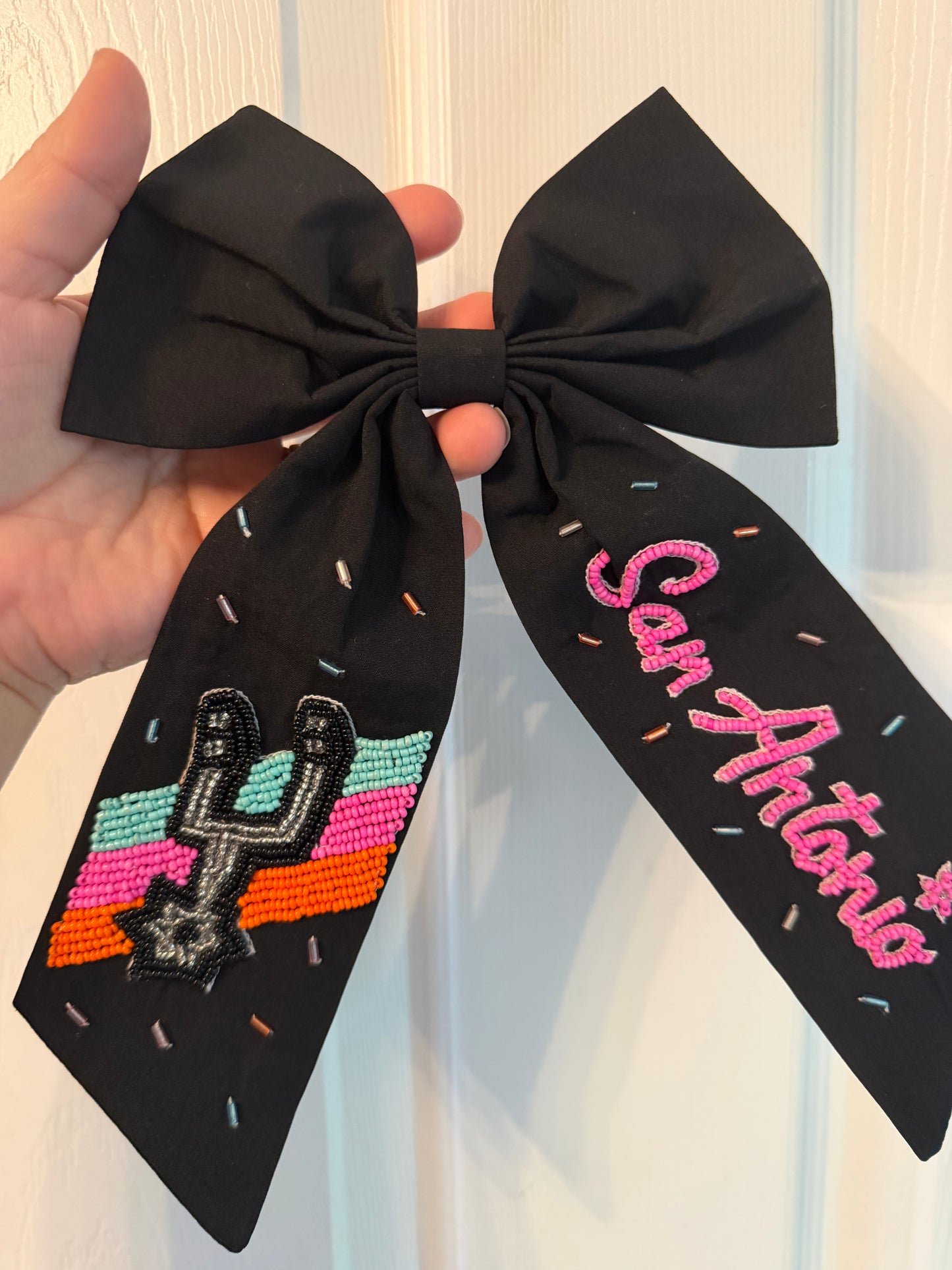 Spurs embroidered beaded bow